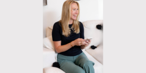 Beth Wand holding a phone