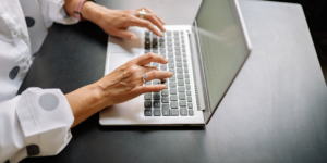 hands typing on instagram