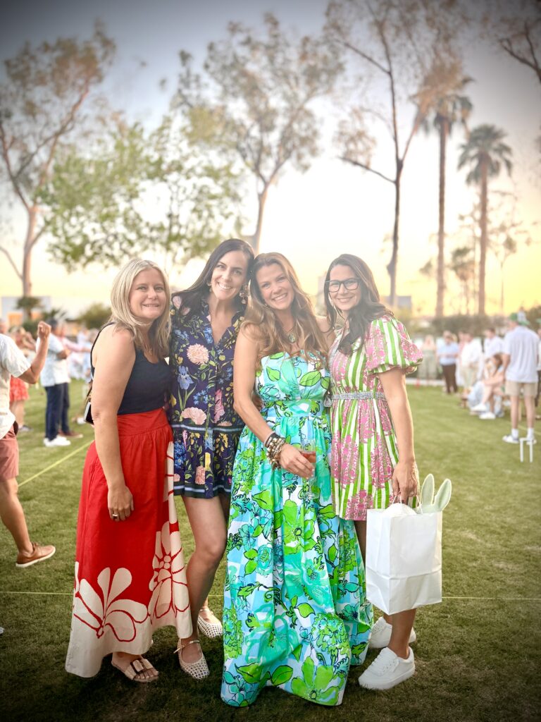 Four women with sunset behind