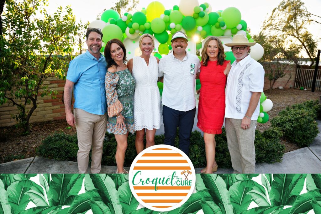 A group picture with croquet for a cure banner logo